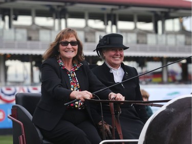 Linda Southern-Heathcott, CEO and president at Spruce Meadows, takes a carriage ride in the International Ring Tuesday September 6, 2016. Spruce Meadows is gearing up to close the season with this week's The Masters. Riding with her is Deb Lederoute.