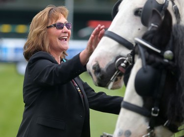Linda Southern-Heathcott, CEO and president at Spruce Meadows, spends a moment with her favorite horses Tully, left, and Lioness in the International Ring Tuesday September 6, 2016. Spruce Meadows is gearing up to close the season with this week's The Masters.