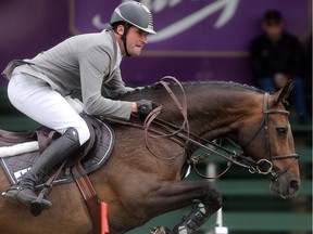 Philipp Weishaupt of Germany rides Catokia 2 in the jump off at the ATCO Founders Classic at Spruce Meadows during The Masters Thursday  September 8, 2016. (Ted Rhodes/Postmedia)