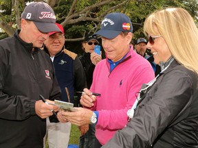 Tom Watson signs autographs after finishing the final round of the Shaw Charity Classic at the Canyon Meadows Golf Club in Calgary on Sept. 4, 2016. Watson finished -6.