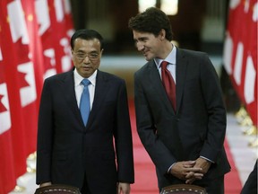 Chinese Premier Li Keqiang and Canadian Prime Minister Justin Trudeau(left to right)stand in the Hall of Honour as they take part in a signing ceremony on Parliament Hill in Ottawa on Thursday, September 22, 2016., 2016.