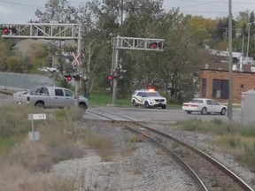 The view of a Calgary intersection as a train approaches.