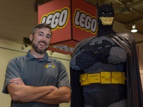 Chris Steininger, one of eight Lego Masters in the world, poses with a Lego Batman he built with his father, Dan, at the Lego ImagineNation Tour at the BMO Centre in Calgary, Alta., on Friday, Sept. 9, 2016. Elizabeth Cameron/Postmedia