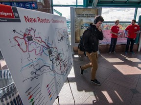 City Transit workers hand out pamphlets explaining the new city bus routes at the Brentwood LRT station in Calgary, Ab., on Monday September 5, 2016.
