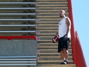 Jon Cornish watches Stamps practice while he was injured in 2015. The retired runningback is trying his hand at improv starting on Monday with Dirty Laundry.