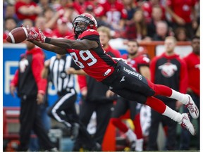 Calgary Stampeders' DaVaris Daniels has the ball slip through his fingers during second half CFL football action against the Ottawa Redblacks in Calgary, Saturday, Sept. 17, 2016.