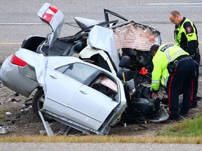 Police investigate a single vehicle crash on Deerfoot just south of Seton Blvd. on Friday September 30, 2016.