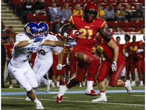 CALGARY, AB -- The U of C Dino's Jeshrun Antwi outruns a tackle during game action against UBC at McMahon Stadium in Calgary, on September 9, 2016.