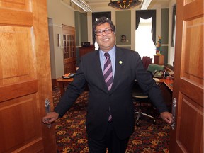 CALGARY, AB.; SEPTEMBER 5, 2012 — Mayor Naheed Nenshi opens the doors to his Calgary City Hall office to help promote Doors Open YYC-DO YYC, September 5, 2012.