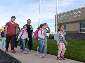 Six new schools were opened for the first day back, including Copperfield School, shown here as students arrive in Calgary, Alta., on Tuesday, Sept. 6, 2016. Elizabeth Cameron/Postmedia