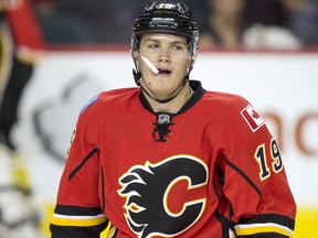 Matthew Tkachuk of the Calgary Flames skates during warmup before a game against the Edmonton Oilers in Calgary, Alta., on Monday, Sept. 26, 2016. It was the first pre-season game for both teams, a split-squad matchup with the other half of each team in the opposite city. Lyle Aspinall/Postmedia Network