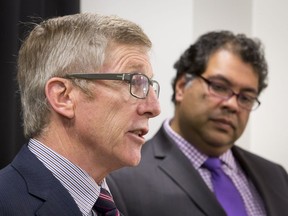 Former police chief Rick Hanson, seen with Mayor Naheed Nenshi, will chair a volunteer group studying the feasibility of Calgary making a bid for the 2026 Winter Olympics.