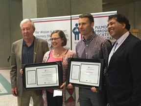 Robert Davidson, CPFF president, and Calgary Mayor Naheed Nenshi flank healthcare providers Charlene Fell and Kirk Mathison, who were honoured at city hall on Tuesday for their work with a fatal lung disease called Idiopathic Pulmonary Fibrosis.