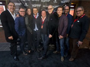 (L-R) Executive producer Mike Frislev, actor Vincent Gale, actress Kelly Overton, actor David Cubitt, executive producer Chad Oakes, actor Christopher Heyerdahl, actor Jonathan Scarfe, writer Simon Barry and director Michael Nankin gather for a photo on the black carpet outside the Globe Cinema in downtown Calgary.