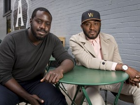 Lanre Rahman (L) and Sadiq Imam pose for a photo outside of Analog Coffee in Calgary, Alta., on Tuesday, Sept. 27, 2016. They're starting a business called MealBlvd, which aims to pair hosts with guests for a shared culinary experience. Lyle Aspinall/Postmedia Network