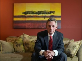 Martin West poses for a portrait in his home in Calgary. West has written a book of short stories set in Alberta.