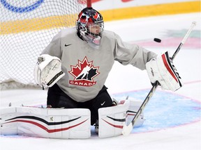 Canada's Mason McDonald makes a save during practice in Helsinki, Finland on Friday, December 25, 2015, prior to the start of the IIHF World Junior Championship on Dec 26.