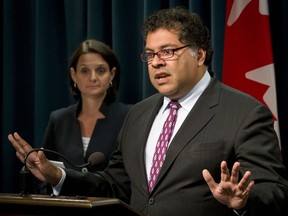 Mayor Naheed Nenshi speaks to media near Danielle Larivee, the provincial Municipal Affairs minister, at the McDougall Centre in Calgary, Alta., on Wednesday, Sept. 14, 2016. They were giving details on public input sessions relating to the creation of city charters for Calgary and Edmonton. Lyle Aspinall/Postmedia Network