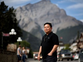 Ericson Dizon is a temporary foreign worker from the Philippines working as housekeeper at a hotel in Banff, Alta., on Sunday August 21, 2016.