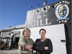 Jill Johnson, right, and her sister, Tracy, co-owners of Atlantic Trap & Gill, outside their Calgary business.