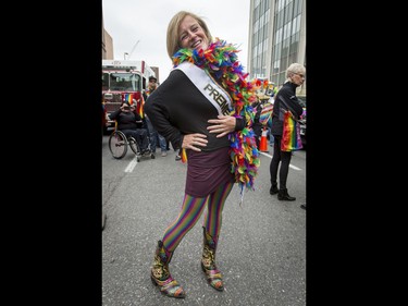 Premier Rachel Notley strikes a pose before walking in the Calgary Pride Parade in the city's downtown core on Sunday, Sept. 4, 2016. About 60,000 people were expected to watch the annual parade, as more than 125 entries took part. Lyle Aspinall/Postmedia Network