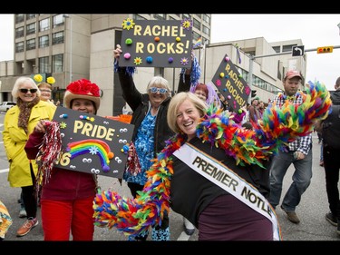 Premier Rachel Notley mugs for a photo with spectators in the Calgary Pride Parade in the city's downtown core on Sunday, Sept. 4, 2016. About 60,000 people were expected to watch the annual parade, as more than 125 entries took part. Lyle Aspinall/Postmedia Network