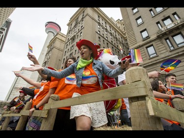 The Alberta NDP float makes its way through the Calgary Pride Parade in the city's downtown core on Sunday, Sept. 4, 2016. About 60,000 people were expected to watch the annual parade, as more than 125 entries took part. Lyle Aspinall/Postmedia Network