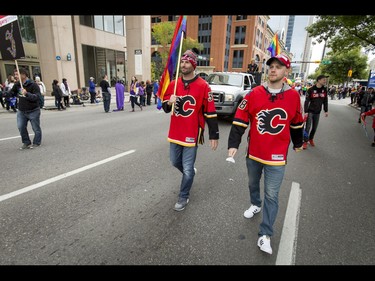 Troy Brouwer and Matt Stajan of the Calgary Flames walk in the Calgary Pride Parade in the city's downtown core on Sunday, Sept. 4, 2016. About 60,000 people were expected to watch the annual parade, as more than 125 entries took part. Lyle Aspinall/Postmedia Network