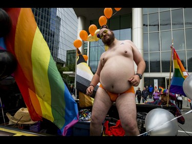 Adam Morison dances for the Fellowship of Alberta Bears dances during the Calgary Pride Parade in the city's downtown core on Sunday, Sept. 4, 2016. About 60,000 people were expected to watch the annual parade, as more than 125 entries took part. Lyle Aspinall/Postmedia Network