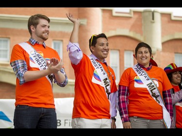 Self-named 'MLGays' Michael Connolly, Richardo Miranda and Estefania Cortes-Vargas stand on stage after the Calgary Pride Parade in the city's downtown core on Sunday, Sept. 4, 2016. About 60,000 people were expected to watch the annual parade, as more than 125 entries took part. Lyle Aspinall/Postmedia Network