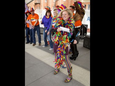 Premier Rachel Notley dances on stage after speaking at the conclusion of the Calgary Pride Parade in the city's downtown core on Sunday, Sept. 4, 2016. About 60,000 people were expected to watch the annual parade, as more than 125 entries took part. Lyle Aspinall/Postmedia Network