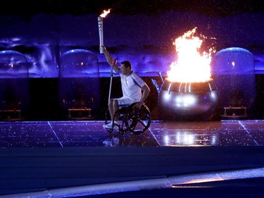 Paralympic swimming medalist Clodoaldo Silva lights the Paralympic flame during opening opening ceremonies of the Rio Paralympics in Rio De Janerio, Brazil  on Tuesday September 6, 2016. Leah hennel/Postmedia