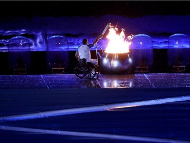 Paralympic swimming medalist Clodoaldo Silva lights the Paralympic caoldren during opening ceremonies of the Rio Paralympics in Rio De Janerio, Brazil  on Tuesday September 6, 2016. Leah hennel/Postmedia