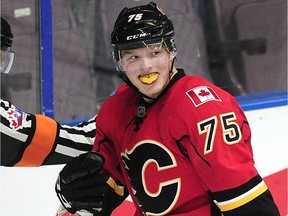 Calgary Flames forward Eetu Tuulola (75) celebrates his goal against the Vancouver Canucks during second period 2016 NHL Young Stars Classic action at the South Okanagan Events Centre in Penticton, BC., September 19, 2016.