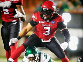 Calgary Stampeders Taylor Reed celebrates after bring down  quarterback Darian Durant of the Saskatchewan Roughriders during CFL football in Calgary, Alta., on Thursday, August 4, 2016. AL CHAREST/POSTMEDIA