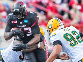 Calgary Stampeders Jerome Messam runs the ball against Edmonton Eskimos during CFL football in Calgary, Alta., on Monday, September 5, 2016. AL CHAREST/POSTMEDIA