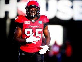 Calgary Stampeders Ja'gared Davis runs onto the field during player introductions before facing the BC Lions in CFL football in Calgary, Alta., on Friday, July 29, 2016. AL CHAREST/POSTMEDIA