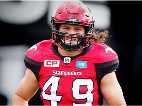 Calgary Stampeders Alex Singleton runs onto the field during player introductions before facing the Ottawa Redblacks in CFL football in Calgary, Alta., on Saturday, September 17, 2016.
