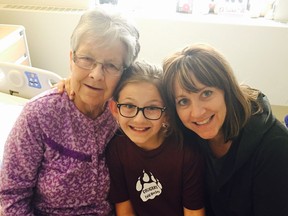 80-year-old Dementia patient Ann Derwent at the Peter Lougheed Centre with her granddaughter Olivia and daughter Darilyn Fortuna last May. Family Handout/Postmedia