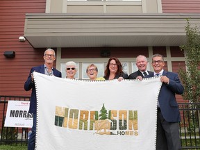 Representatives of Morrison Homes, the YWCA, Resolve and the Calgary Homeless Foundation celebrate the opening of Providence House on Thursday September 29, 2016. The newly built affordable and supported rental home which will provide a safe haven for 24 homeless and vulnerable women in Calgary. By offering integrated, on-site access to social support services on a 24-7 basis, residents are given the foundations needed to restart and rebuild their lives.