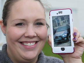 Jennifer Allen shows a photo on Thursday September 22, 2016 of her BMW SUV which was stolen from her Calgary, Alta home overnight Wednesday. The vehicle was quickly recovered by police with help of a Facebook post. Jim Wells//Postmedia
