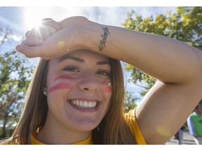 CALGARY, AB -- Allison Mulhall, a first-year U of C Kinesiology student, shows off her #IBelieveYou fake tattoo prior to joining approximately 1400 U of C students participating in a game of Red Light, Green Light, to break a Guinness World Record at McMahon Stadium in Calgary, on September 9, 2016. The game was organized by the Women's Resource Centre in collaboration with the Consent, Awareness and Sexual Education student club in the aim to raise awareness and educate students about the importance of sexual consent. --  (Crystal Schick/Postmedia) (For City story by  ) 20076110A