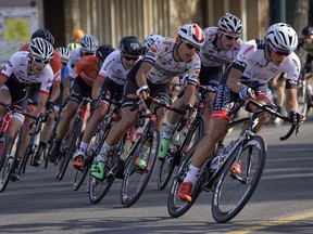 Riders pass through the downtown core during the first stage race of the Tour of Alberta cycling race in, Lethbridge, Alta., Thursday, Sept 1, 2016. Cyclists ride nine laps to complete the 107-kilometre circuit. The race attracts 120 cyclists from around the world.