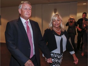 Federal Court Justice Robin Camp, left, and his wife Maryann arrive at a Canadian Judicial Council inquiry in Calgary.