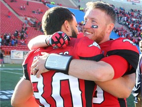 Stampeders kicker Rene Paredes (L) and QB Bo Levi Mitchell celebrate at the end of the game after Paredes kicked the winning field goal for a 36-34 win over the Calgary Stampeders and the Winnipeg Blue Bombers in Calgary, Alta. on Saturday September 24, 2016. Jim Wells/Postmedia
