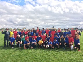 Calgary Police Service and the Syrian Soccer Sons gather for a team photo.