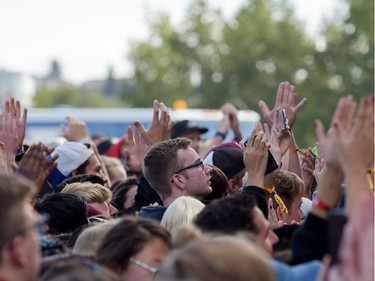 The audience claps along to a performance by Atlas Genius at X-Fest 2016 in Calgary, Alta., on Sunday, Sept. 4, 2016.