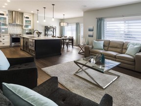 The great room and kitchen in the Aydon 2 show home by ReidBuilt Homes in Vista Crossing in Crossfield.