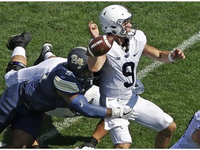 Pittsburgh defensive lineman Tyrique Jarrett (6) forces a fumble by Penn State quarterback Trace McSorley (9) during the first half of an NCAA college football game in Pittsburgh, Saturday, Sept. 10, 2016. Pittsburgh recovered the fumble.