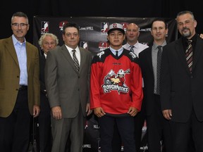 Vaughn Harris poses with representatives of the Calgary Roughnecks after being selected in the second round, 15th overall, of the NLL draft in Toronto on Monday, Sept. 26, 2016. (Courtesy Calgary Sports and Entertainment Corporation)